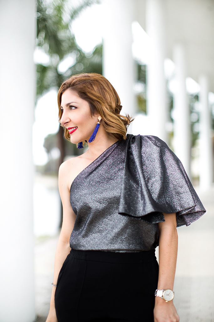 Blame-it-on-Mei-Miami-Fashion-Blogger-2016-Holiday-Outfit-NYE-Look-Metallic-Asymetric-Top-with-Ruffle-Joggers-Patent-Iriza-Louboutin-Beaded-Clutch-Tassel-Earrings-Curls-Short-Hair